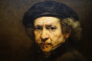 self-portrait of famous painter Rembrandt Smithsonian National Gallery of Art. Middle-aged man in hat looking at viewer